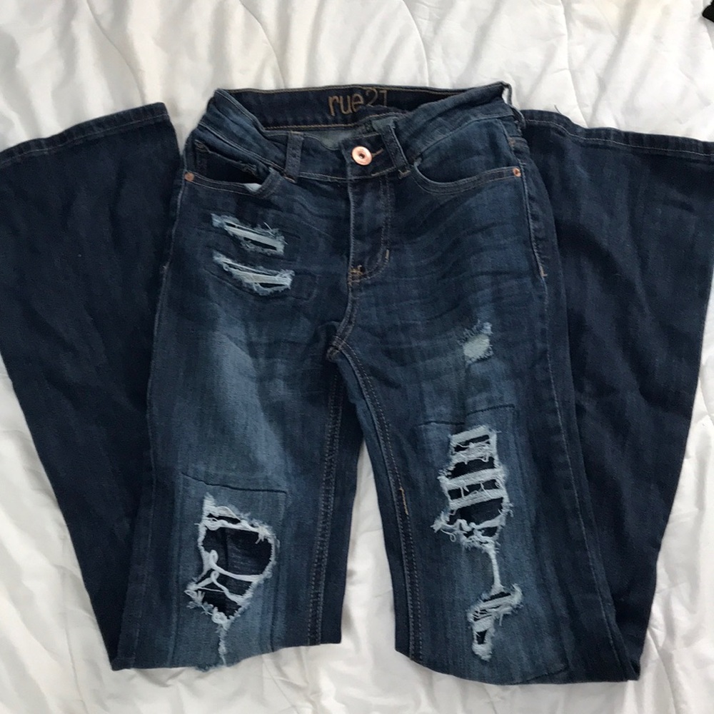Mid rise boot jeans with distressing